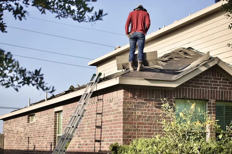 Professional roofer working on a residential roof in Lakewood Corner Estates
